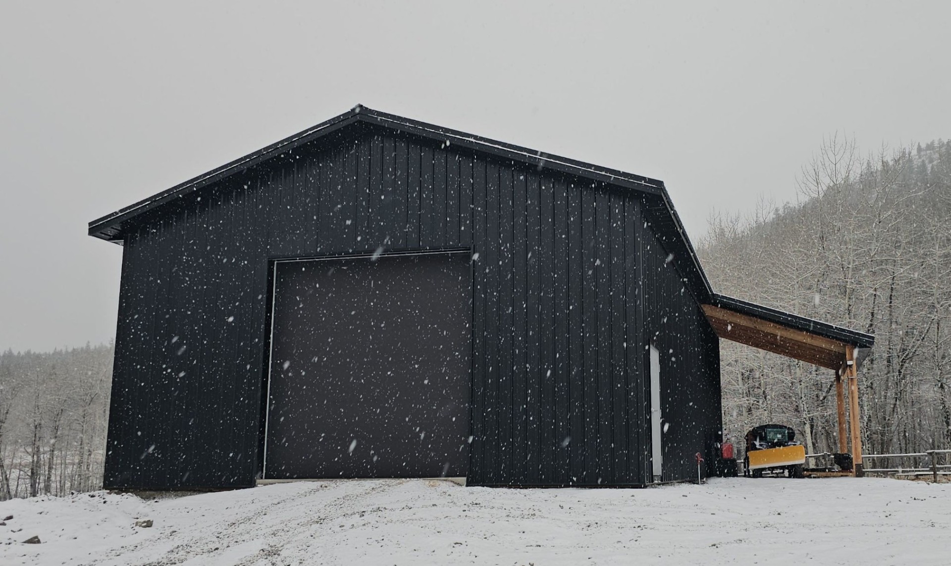 Interior framing of post-frame shop under construction
