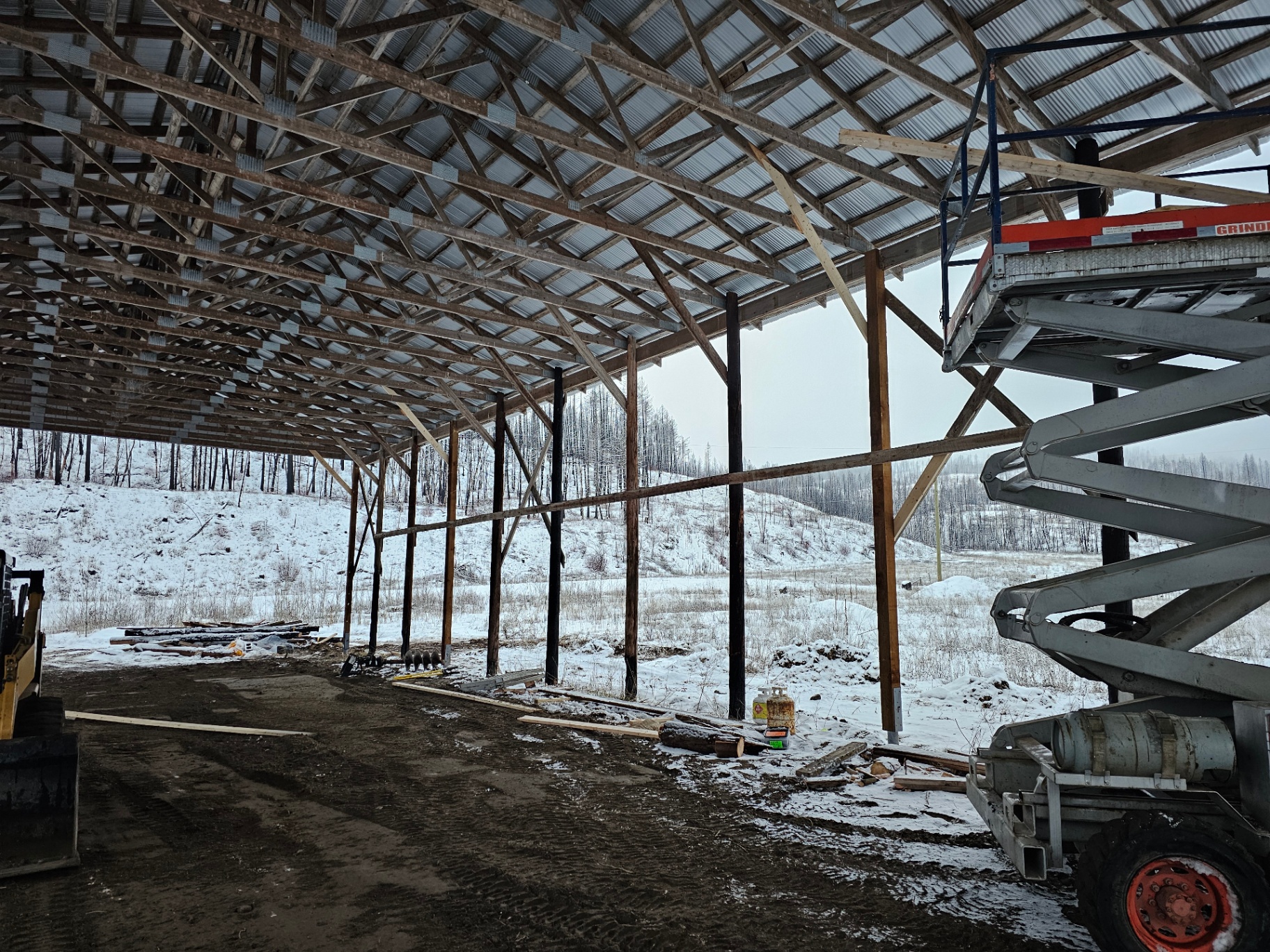 New posts installed in hay shed interior near Lumby