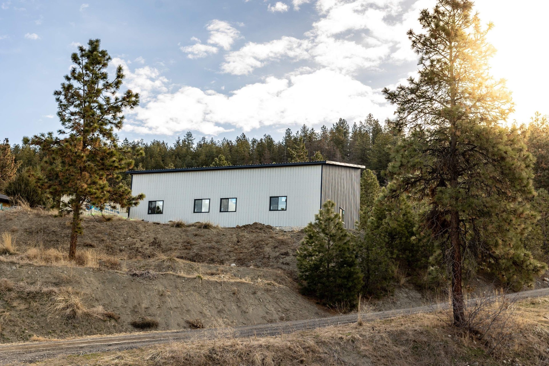 Post-frame garage with side windows on South Okanagan property