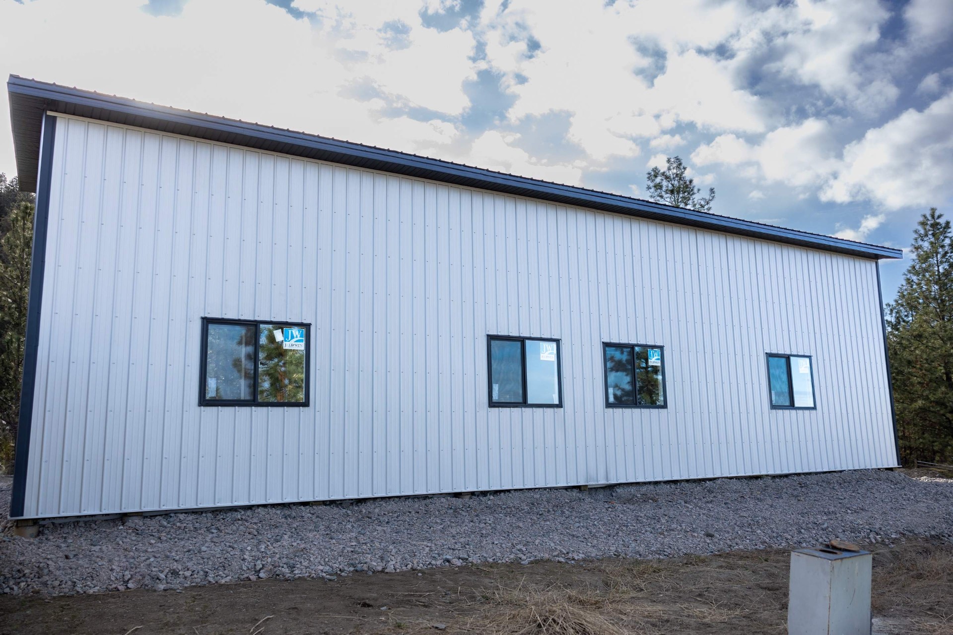 White post-frame garage on a Central Okanagan property
