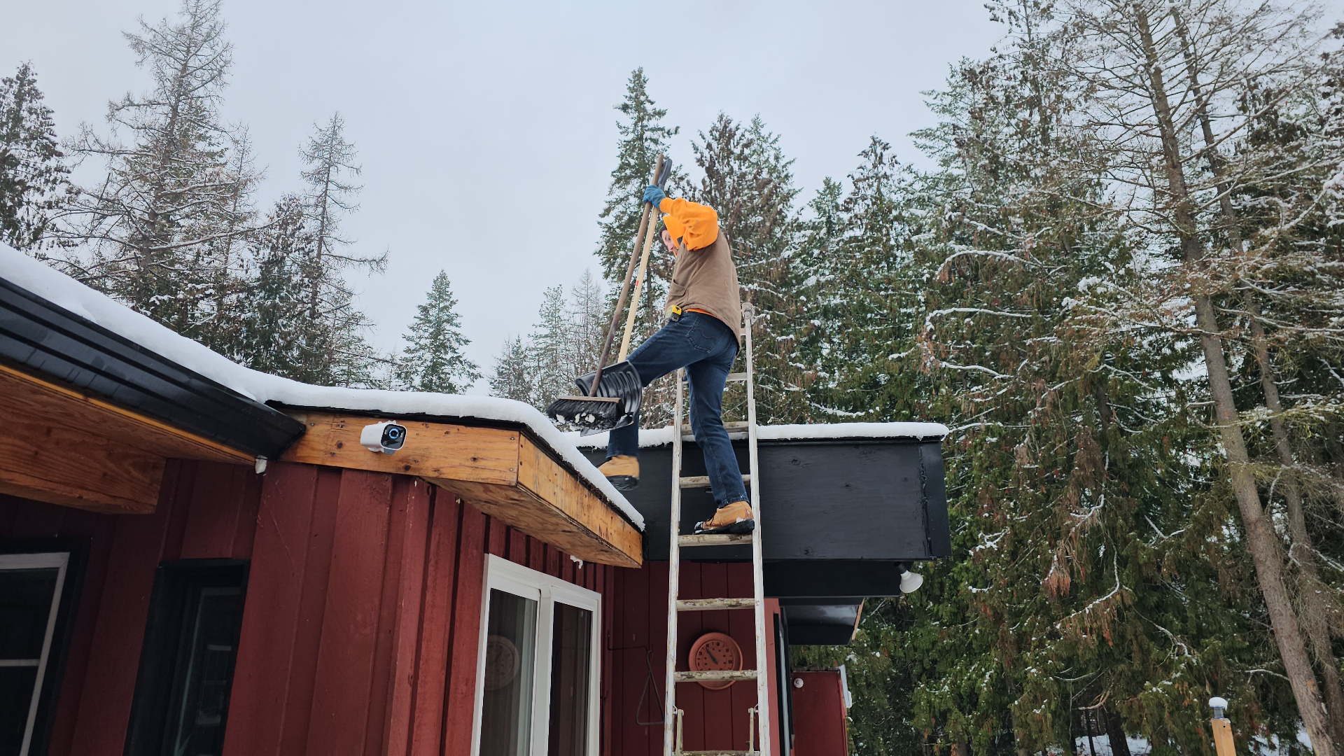 Farrow Built roofer working on a roof during winter