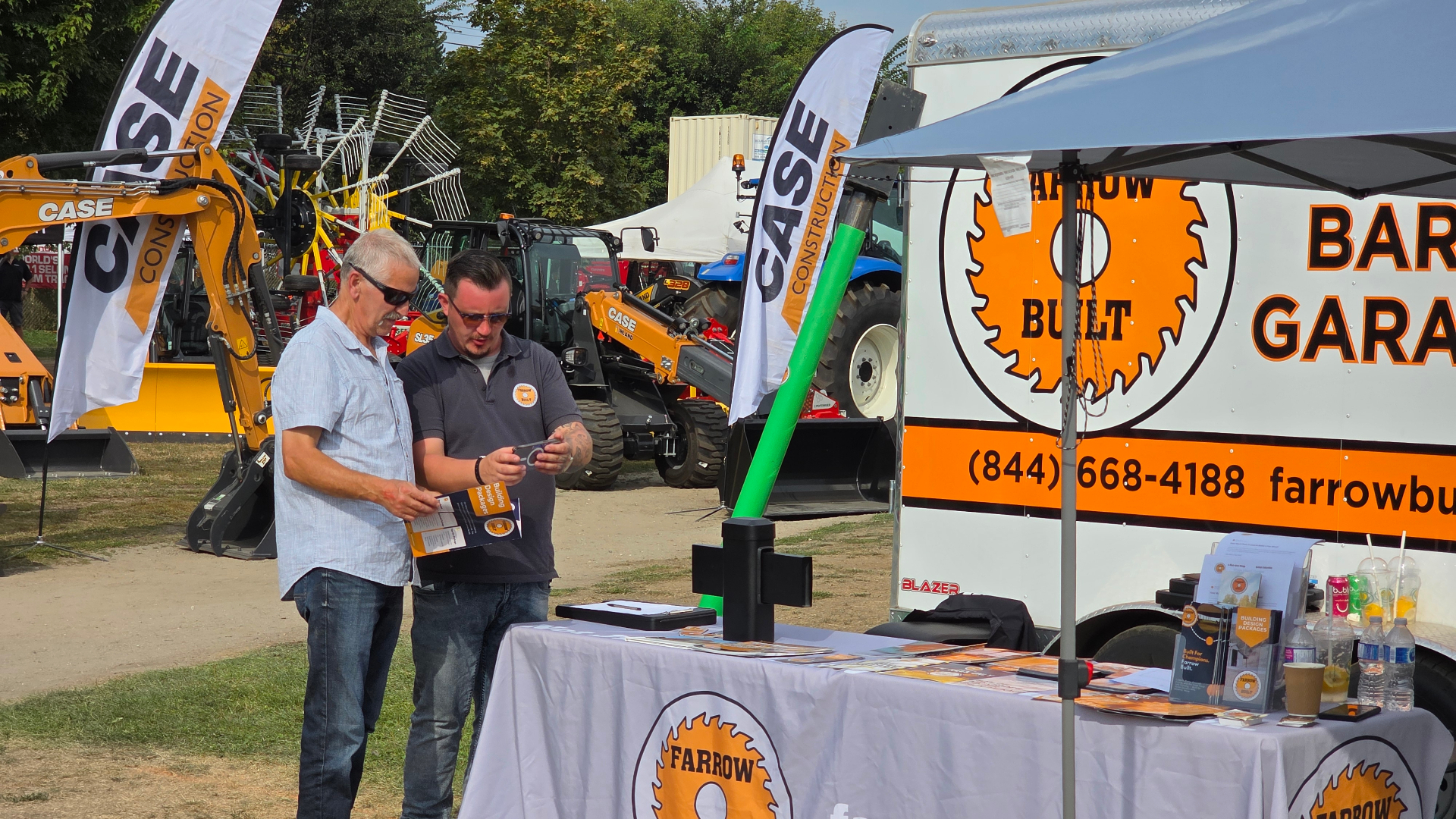Farrow Built sales representative discussing builds with customers at tradeshow